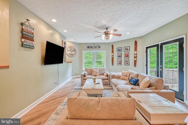 520 Oak Grove Dr, Mineral, VA 23117 - living room featuring light wood-style floors, a textured ceiling, baseboards, recessed lighting, and a ceiling fan