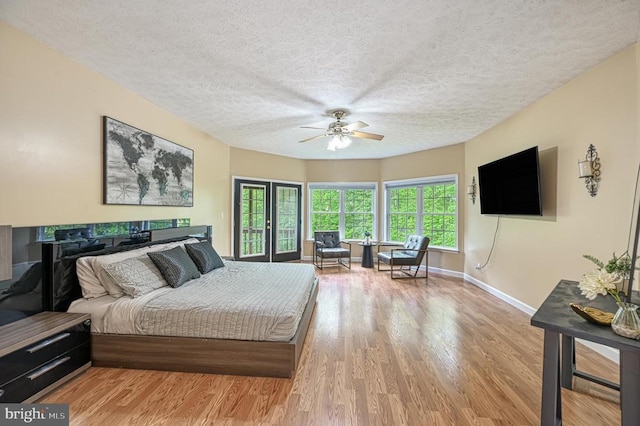 520 Oak Grove Dr, Mineral, VA 23117 - bedroom with multiple windows, wood finished floors, a textured ceiling, baseboards, and a ceiling fan