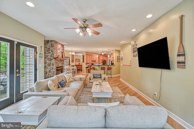 520 Oak Grove Dr, Mineral, VA 23117 - living room featuring ceiling fan, baseboards, light wood finished floors, recessed lighting, and a fireplace