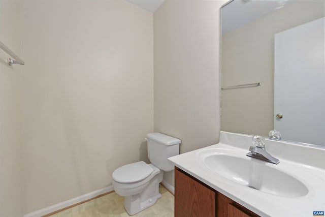 903 Stonehenge Rd, Charlottesville, VA 22901 - bathroom featuring toilet, vanity, and baseboards
