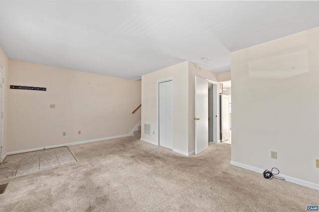 903 Stonehenge Rd, Charlottesville, VA 22901 - carpeted empty room with stairs and baseboards