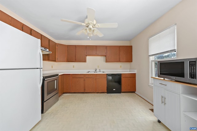 903 Stonehenge Rd, Charlottesville, VA 22901 - kitchen with appliances with stainless steel finishes, a sink, exhaust hood, and light countertops