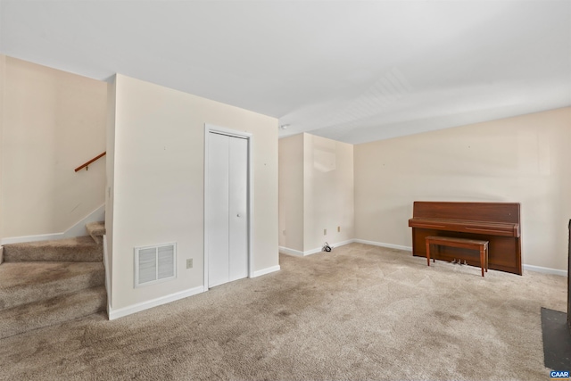903 Stonehenge Rd, Charlottesville, VA 22901 - unfurnished living room with carpet flooring, stairs, baseboards, and lofted ceiling