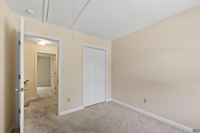 903 Stonehenge Rd, Charlottesville, VA 22901 - unfurnished bedroom with attic access, carpet floors, baseboards, and a closet