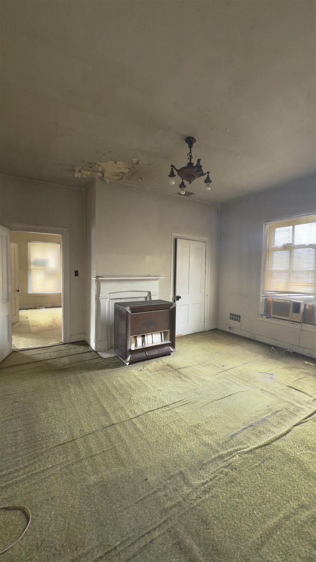 2329 Fort Ave, Lynchburg, VA 24501 - unfurnished living room with carpet floors and cooling unit