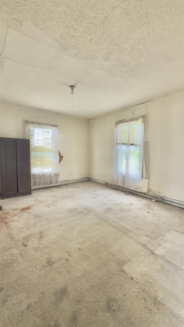 2329 Fort Ave, Lynchburg, VA 24501 - empty room featuring a textured ceiling and carpet floors