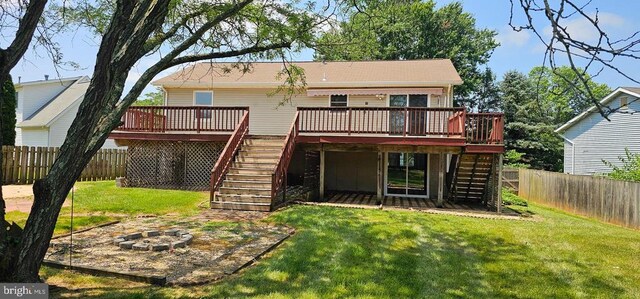 1632 Harrier Ln, Culpeper, VA 22701 - back of property with stairway, a wooden deck, a fenced backyard, and an outdoor fire pit