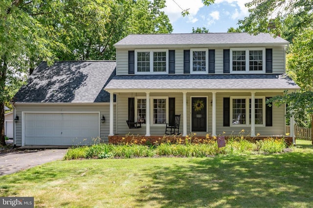 5310 Leavells Crossing Dr, Fredericksburg, VA 22407 - view of front of home featuring a garage, driveway, a porch, a front yard, and roof with shingles
