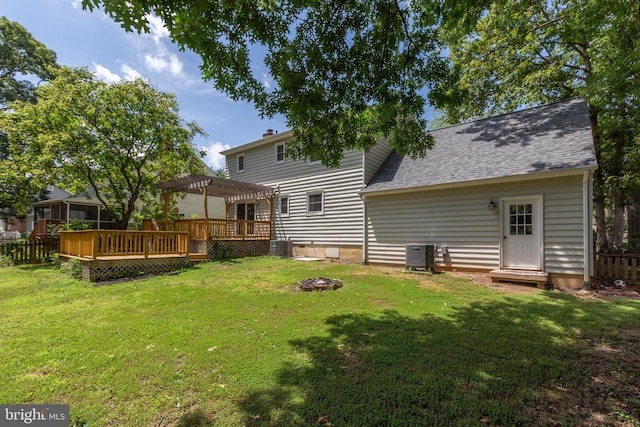 5310 Leavells Crossing Dr, Fredericksburg, VA 22407 - rear view of house featuring a pergola, a wooden deck, a shingled roof, and an outdoor fire pit
