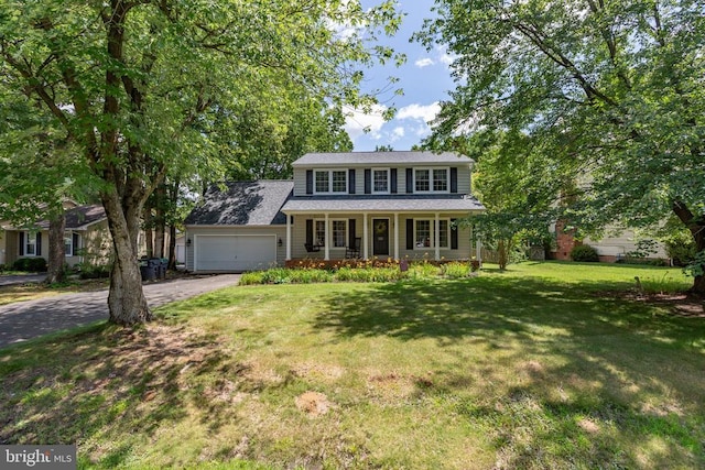 5310 Leavells Crossing Dr, Fredericksburg, VA 22407 - view of front of property featuring a porch, an attached garage, asphalt driveway, and a front lawn