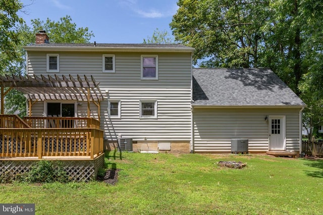 5310 Leavells Crossing Dr, Fredericksburg, VA 22407 - back of house with a chimney, a pergola, a lawn, a deck, and roof with shingles