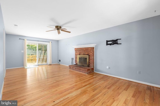 5310 Leavells Crossing Dr, Fredericksburg, VA 22407 - unfurnished living room with a ceiling fan, light wood-style floors, and a fireplace