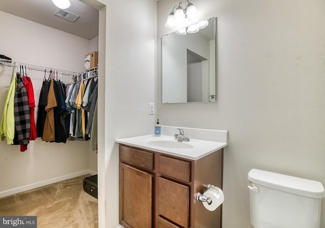 1905 Crepe Myrtle Ln, Culpeper, VA 22701 - bathroom with vanity, a chandelier, and a walk in closet