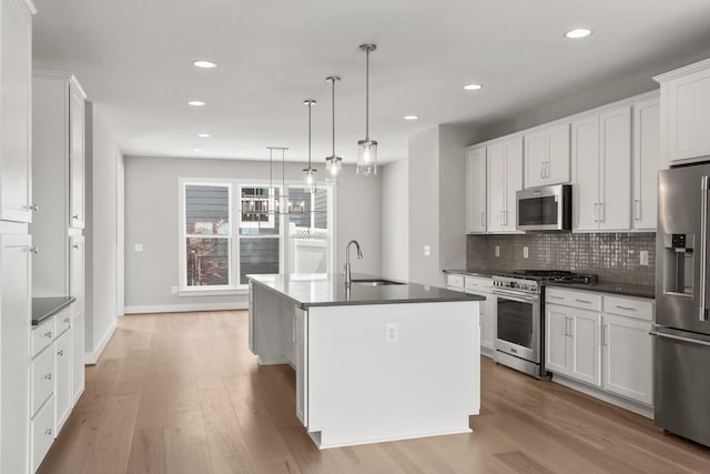 3247 Preston Shore Dr Unit 18D, Rockingham, VA 22801 - kitchen featuring stainless steel appliances, a sink, dark countertops, tasteful backsplash, and recessed lighting