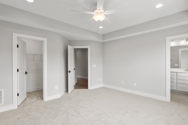 3247 Preston Shore Dr Unit 18D, Rockingham, VA 22801 - unfurnished bedroom with a spacious closet, light carpet, baseboards, recessed lighting, and a closet