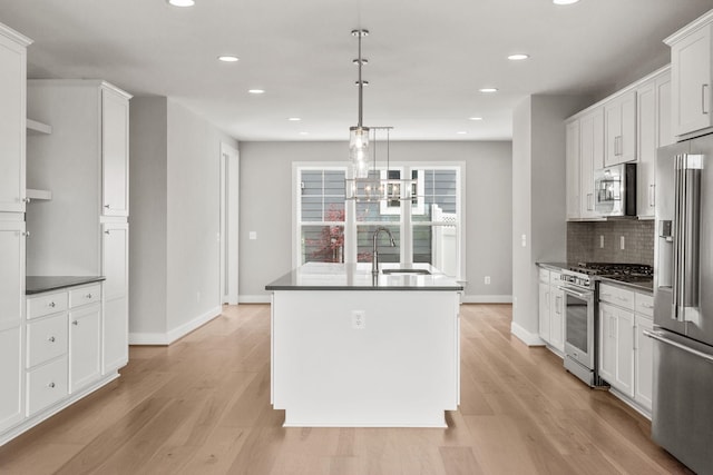 3247 Preston Shore Dr Unit 18D, Rockingham, VA 22801 - kitchen with high quality appliances, dark countertops, a sink, a center island with sink, and recessed lighting