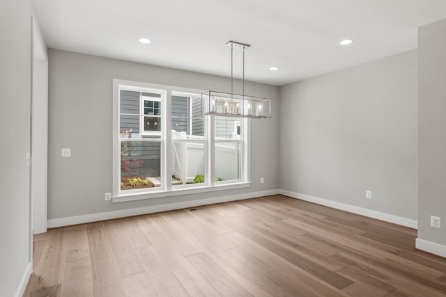 3247 Preston Shore Dr Unit 18D, Rockingham, VA 22801 - unfurnished dining area with a chandelier, light wood-style flooring, baseboards, and recessed lighting