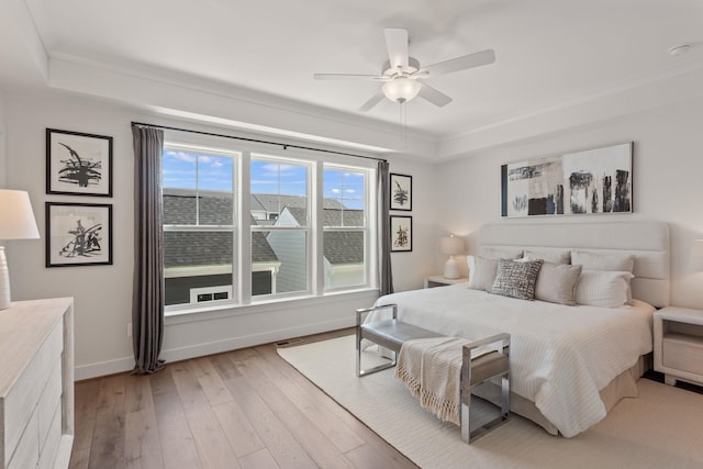 3247 Preston Shore Dr Unit 18D, Rockingham, VA 22801 - bedroom with crown molding, light wood finished floors, a raised ceiling, baseboards, and ceiling fan