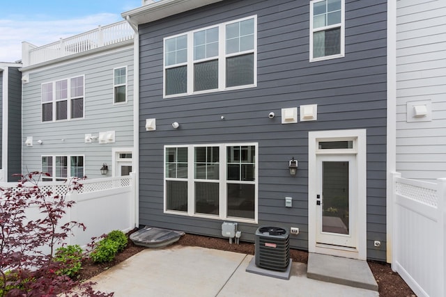 3247 Preston Shore Dr Unit 18D, Rockingham, VA 22801 - rear view of property with a patio area and central AC
