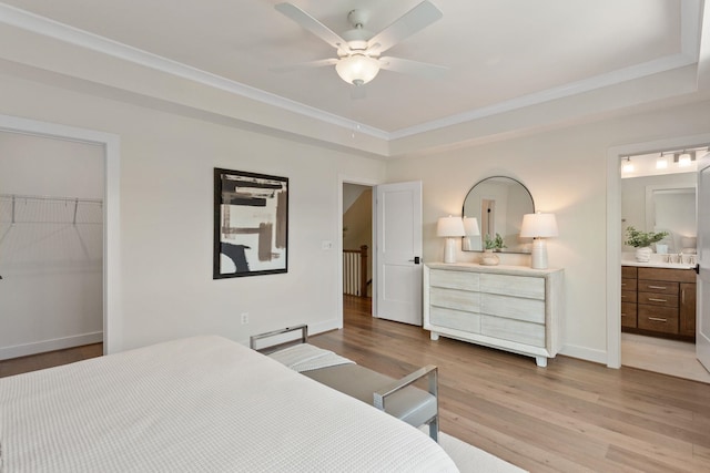 3247 Preston Shore Dr Unit 18D, Rockingham, VA 22801 - bedroom featuring wood finished floors, a tray ceiling, crown molding, baseboards, and a closet