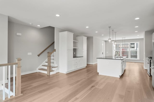 3247 Preston Shore Dr Unit 18D, Rockingham, VA 22801 - kitchen with a sink, recessed lighting, dark countertops, white cabinets, and light wood finished floors