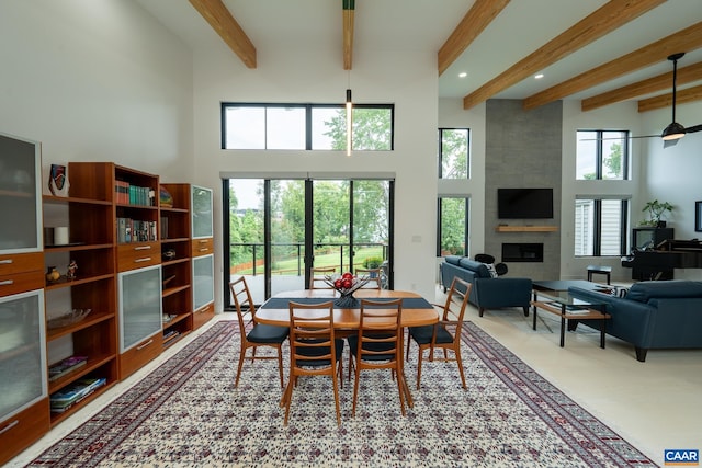 320A 11th St NE, Charlottesville, VA 22902 - dining room featuring beam ceiling, a large fireplace, a high ceiling, and recessed lighting