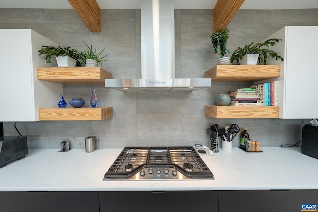 320A 11th St NE, Charlottesville, VA 22902 - kitchen featuring open shelves, wall chimney range hood, stainless steel gas stovetop, backsplash, and light stone countertops