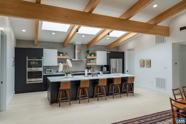 320A 11th St NE, Charlottesville, VA 22902 - kitchen with stainless steel appliances, open shelves, a skylight, light countertops, and modern cabinets