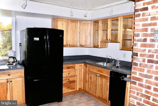 kitchen with sink and black appliances