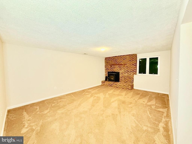 unfurnished living room featuring carpet floors and a textured ceiling