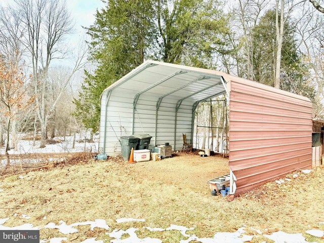 view of outbuilding featuring a carport