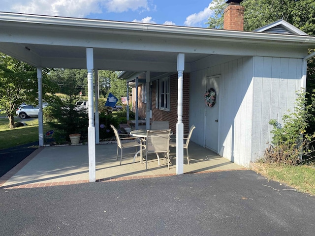 6 Bingham St, Verona, VA 24482 - view of patio with outdoor dining area and an attached carport