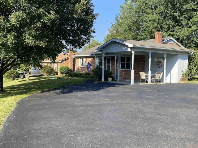 6 Bingham St, Verona, VA 24482 - single story home featuring a front yard, a chimney, brick siding, and a porch