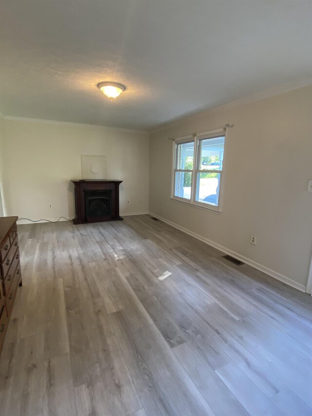 6 Bingham St, Verona, VA 24482 - unfurnished living room with crown molding, wood finished floors, and a fireplace