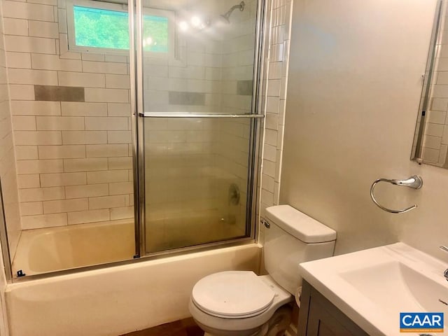 full bathroom featuring vanity, toilet, and enclosed tub / shower combo