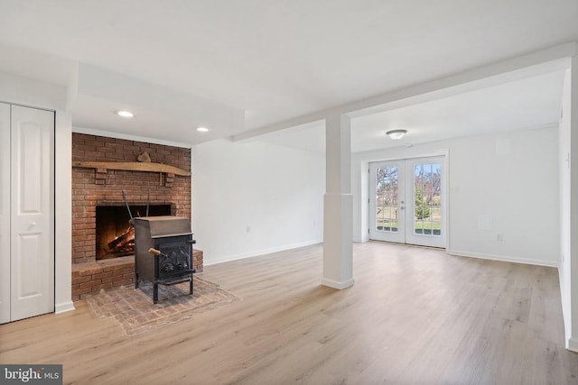 living room featuring baseboards, french doors, recessed lighting, and wood finished floors