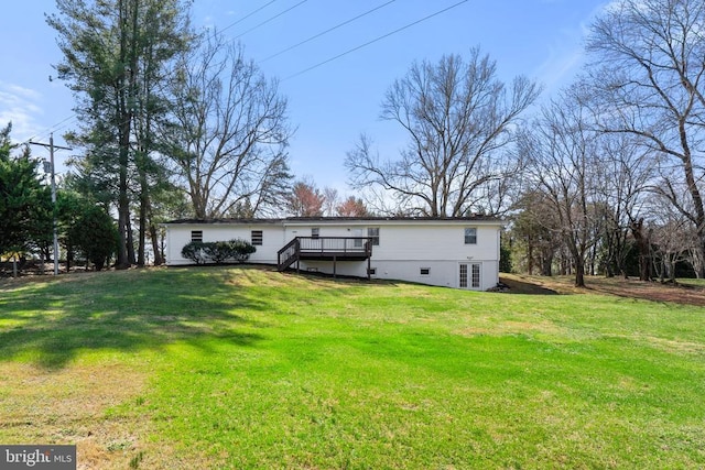 back of house featuring a lawn, french doors, a deck, and stairs