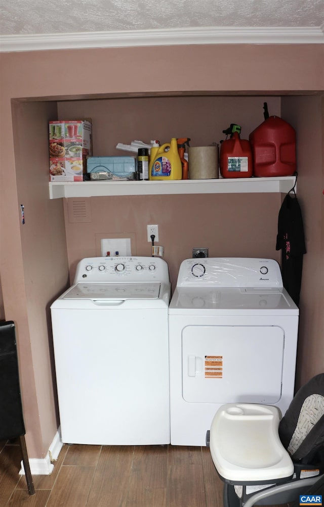 107 Gay St W, Staunton, VA 24401 - washroom with separate washer and dryer, wood finished floors, and ornamental molding