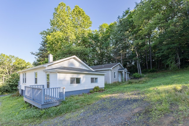 99 Sharp Hill Ln, Hinton, VA 22831 - view of side of property featuring a chimney and a deck