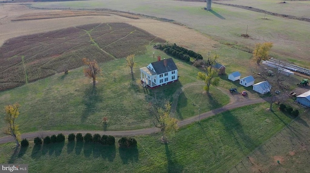 birds eye view of property featuring a rural view