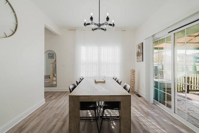 728 Mason St, Dayton, VA 22821 - dining space featuring a chandelier, light wood-style floors, and baseboards