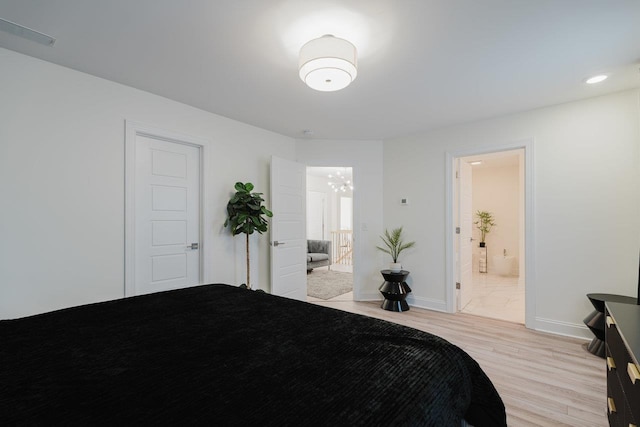 728 Mason St, Dayton, VA 22821 - bedroom with light wood-style flooring, a chandelier, ensuite bath, and baseboards