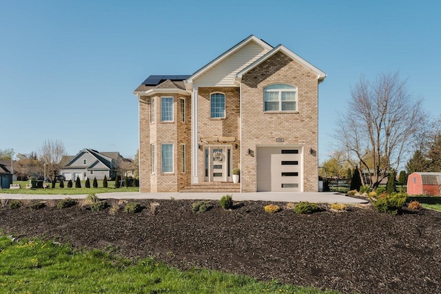 728 Mason St, Dayton, VA 22821 - traditional home with brick siding, roof mounted solar panels, and an attached garage