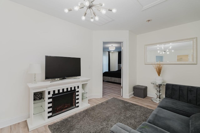 728 Mason St, Dayton, VA 22821 - living room with a chandelier, baseboards, and wood finished floors