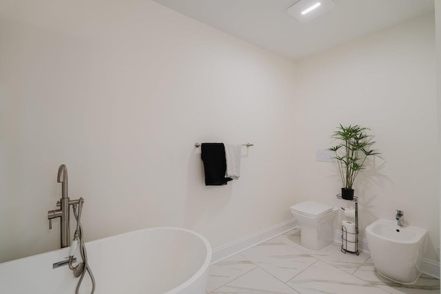728 Mason St, Dayton, VA 22821 - bathroom featuring a bidet, a freestanding tub, marble finish flooring, and toilet