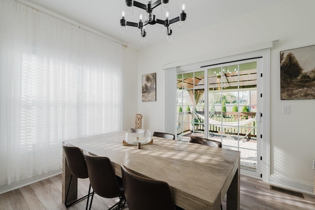 728 Mason St, Dayton, VA 22821 - dining area featuring baseboards, a notable chandelier, visible vents, and light wood-style floors