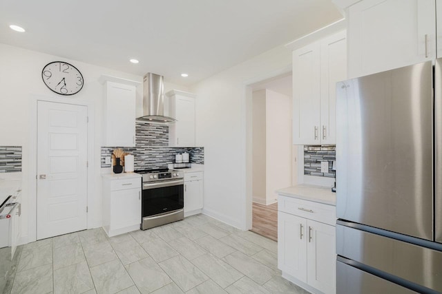 728 Mason St, Dayton, VA 22821 - kitchen with stainless steel appliances, wall chimney range hood, tasteful backsplash, light countertops, and recessed lighting