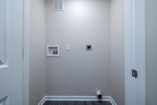 laundry area featuring laundry area, hookup for an electric dryer, hookup for a washing machine, dark wood finished floors, and visible vents