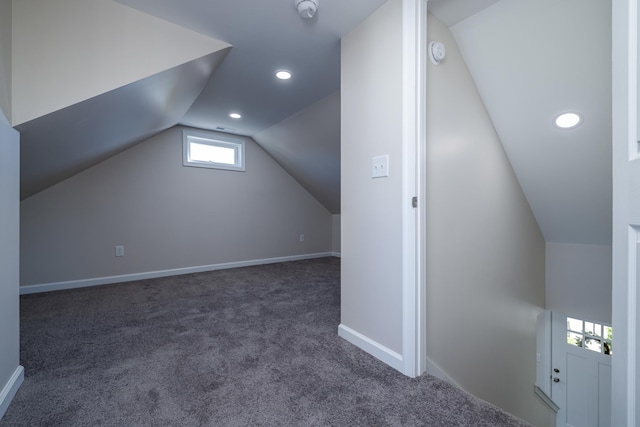 additional living space with carpet, baseboards, lofted ceiling, and recessed lighting