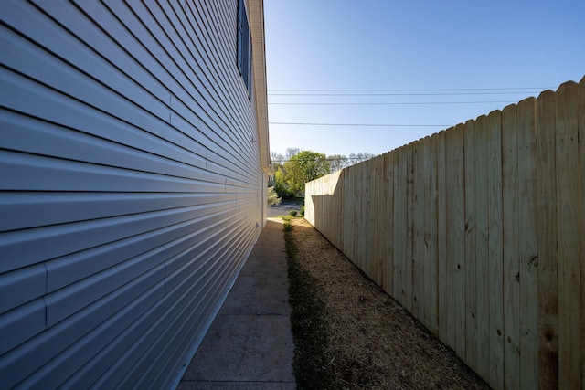 view of home's exterior with fence